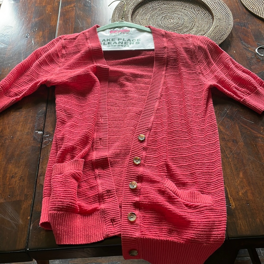 Light sweater coverup, more of a salmon than pink or orange